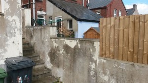 Replacement small Fence on wall before from BiigSul Garden and Maintenance Services